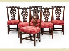 A set of six beautifully carved George II mahogany dining chairs, with unusual collars to legs. Circa 1750.